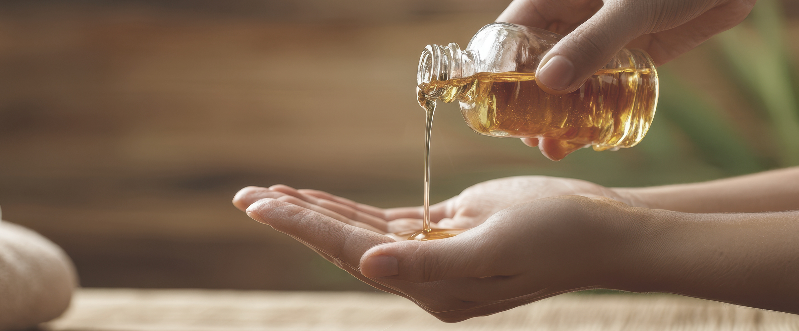 The soothing moment of oil being poured into hands for relaxation.
